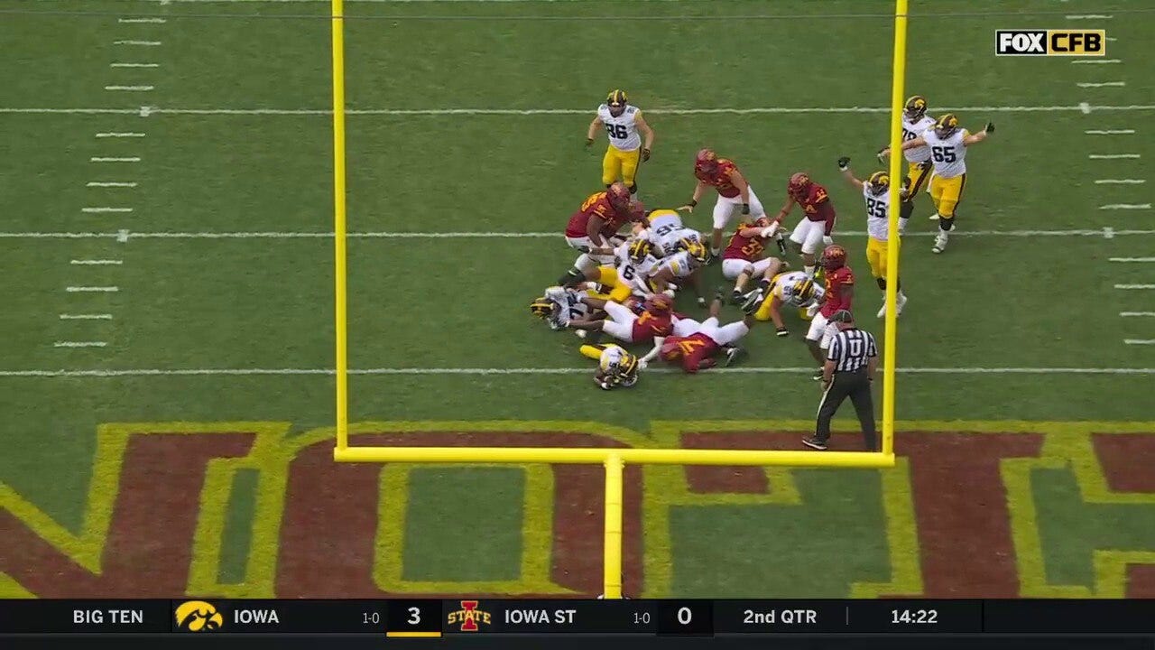 Iowa's Jaziun Patterson rushes up the middle for a four-yard touchdown against Iowa State