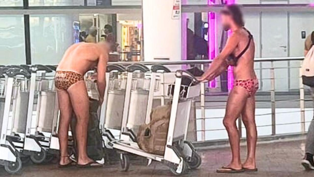 Tourists wearing cheetah print budgie smugglers at Thailand airport