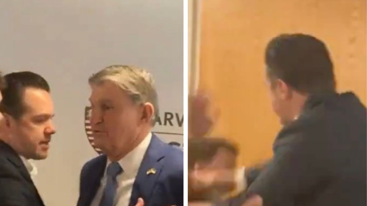 US senator squares up against climate activist before the agitator gets shoved out of the room